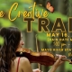 The Creative Trail from Rockingham Arts Council. A young woman in a red dress stands in a forest while playing a fiddle.