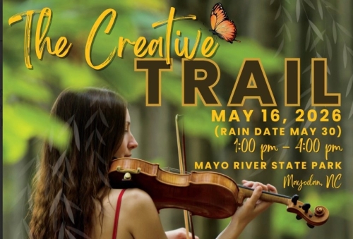 The Creative Trail from Rockingham Arts Council. A young woman in a red dress stands in a forest while playing a fiddle.